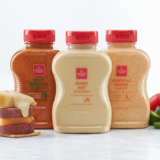 https://www.hickoryfarms.com/dw/image/v2/AAOA_PRD/on/demandware.static/-/Sites-Web-Master-Catalog/default/dw1690000f/images/products/spicy-sauces-flight-17166-1.jpg?sw=556&sh=680&sm=fit