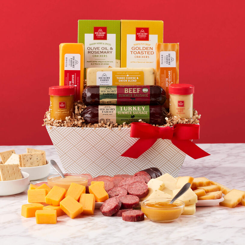 The Signature Flavors Gift Basket includes beef sausage, turkey sausage, mustard, crackers, and various cheeses