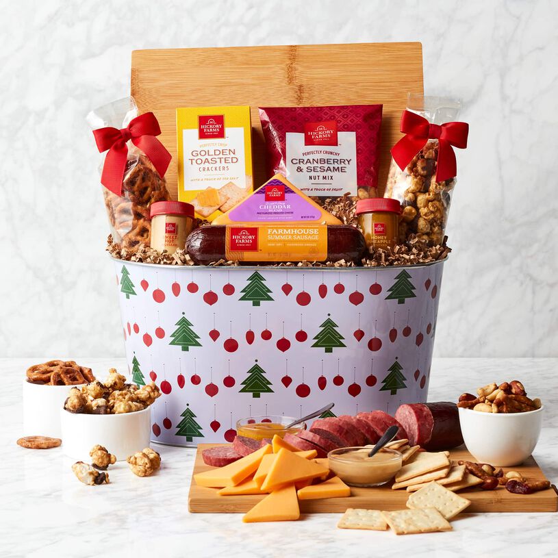 Summer sausage, smooth and creamy cheese, mustard, Golden Toasted Crackers, Cranberry & Sesame Nut Mix, Chocolate Caramel Popcorn, Butter Toffee Pretzels, and a bamboo cheese board. 