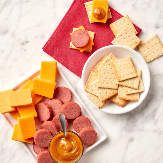 Alternative view of the Sweet & Smoky Turkey Sampler components sliced on marble. 