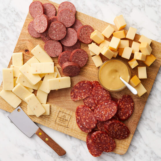 Signature Bites and Board Gift Set includes meat and cheese sliced and arranged on board with mustard 