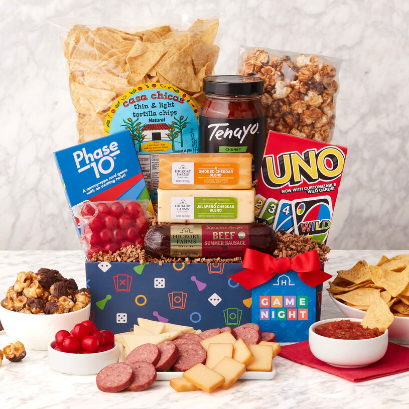 Game Night Gift Set includes beef summer sausage, chips and salsa, popcorn, candy, various cheeses, and card games