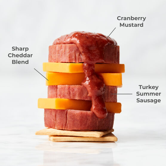 Sweet & Smoky Turkey Summer Sausage paired with Sharp Cheddar Blend and Cranberry Mustard