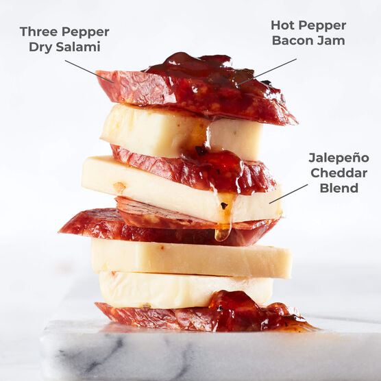 Three Pepper Dry Salami paired with Hot Pepper Bacon Jam and Jalapeño Cheddar Blend