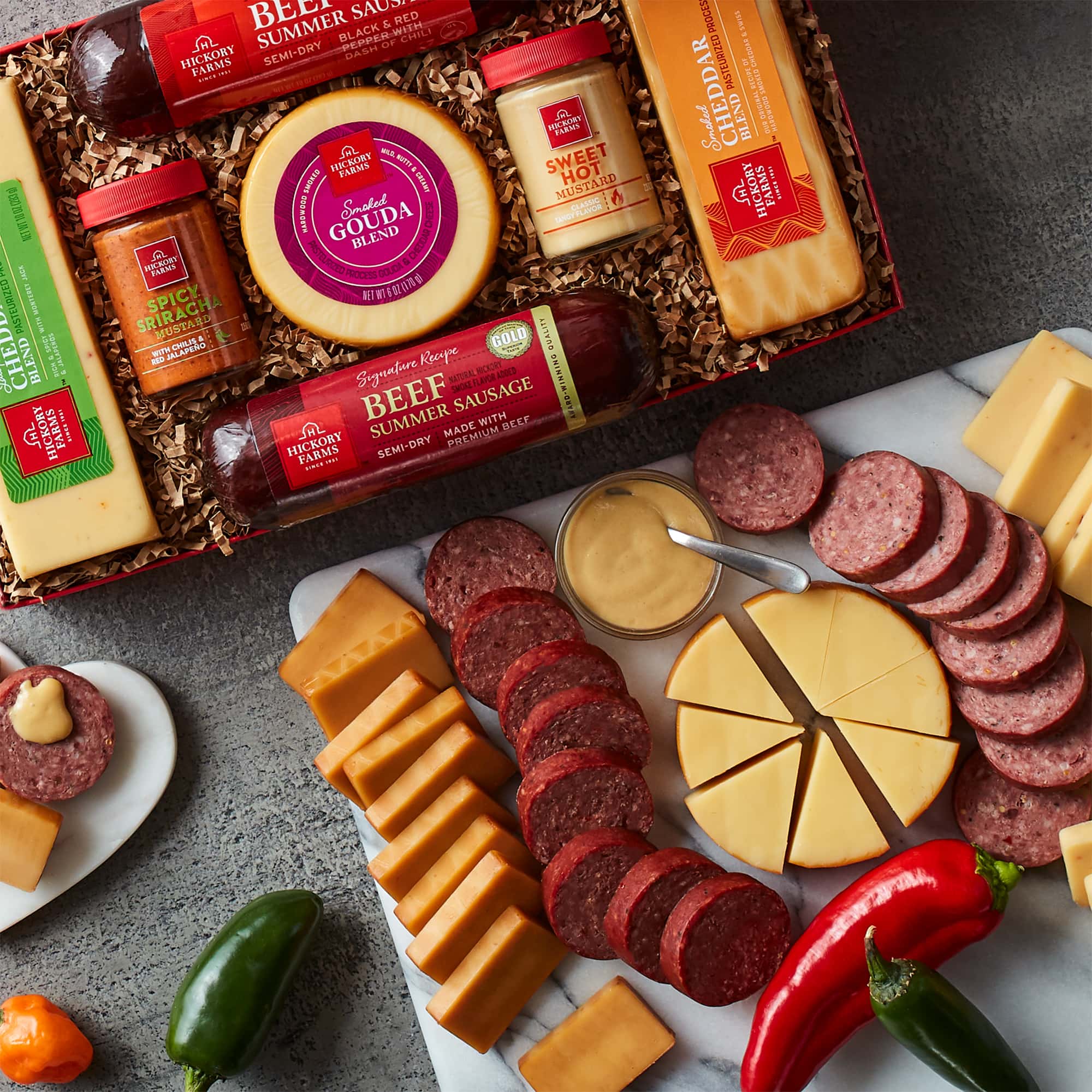 https://www.hickoryfarms.com/on/demandware.static/-/Sites-Web-Master-Catalog/default/dwcd7005fd/images/products/hot-stuff-summer-sausage-cheese-gift-box-006541-2.jpg
